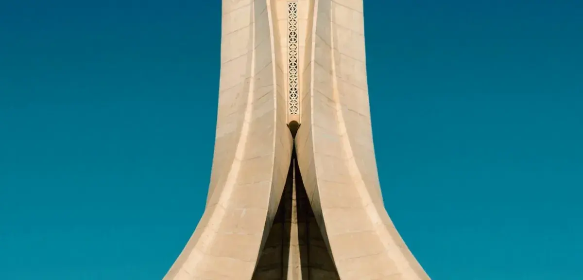 white concrete building under blue sky during daytime