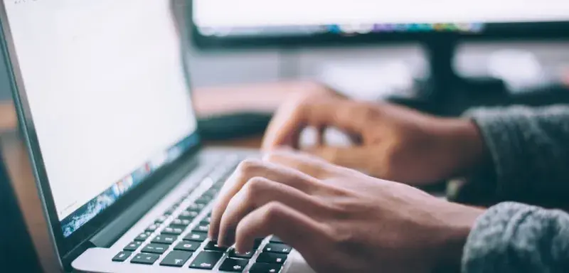 person using MacBook Pro