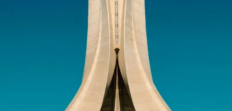 white concrete building under blue sky during daytime