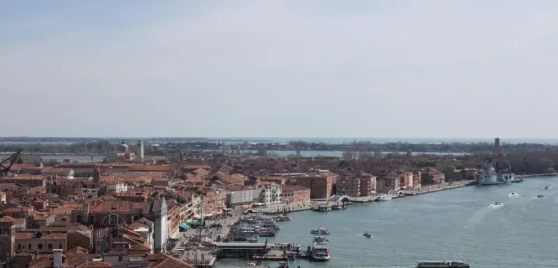 Aerial view of Venice showing the city's famous waterfront and architecture on a clear day.