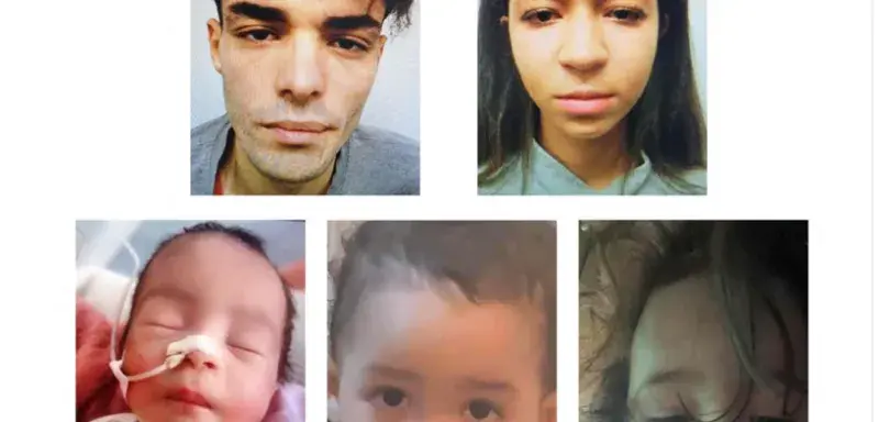 baby covered with white blanket