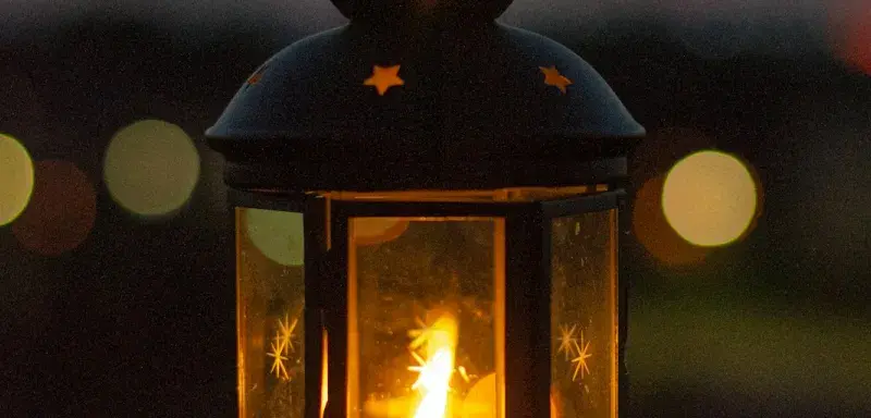black lantern with fire during night time