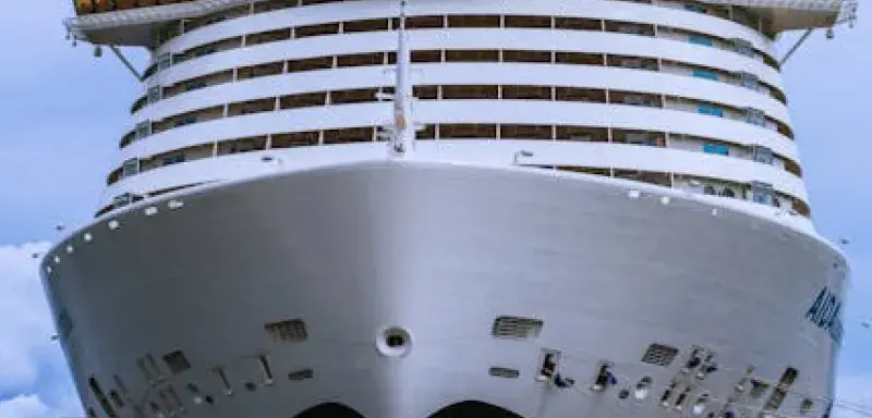 Front view of a large cruise ship docked at the port of Ajaccio, Corsica.