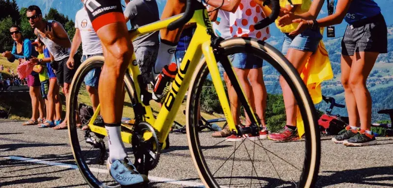 man riding yellow bicycle