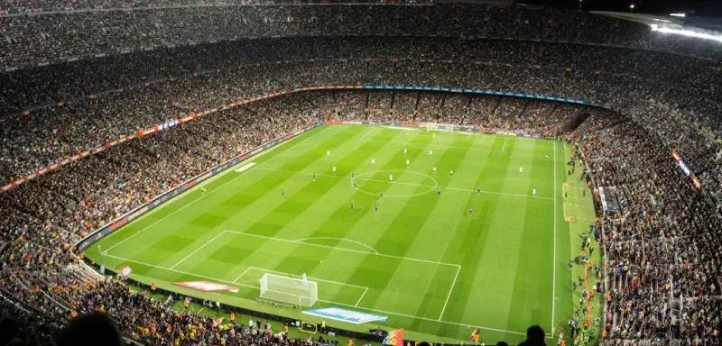 people watching soccer game in stadium