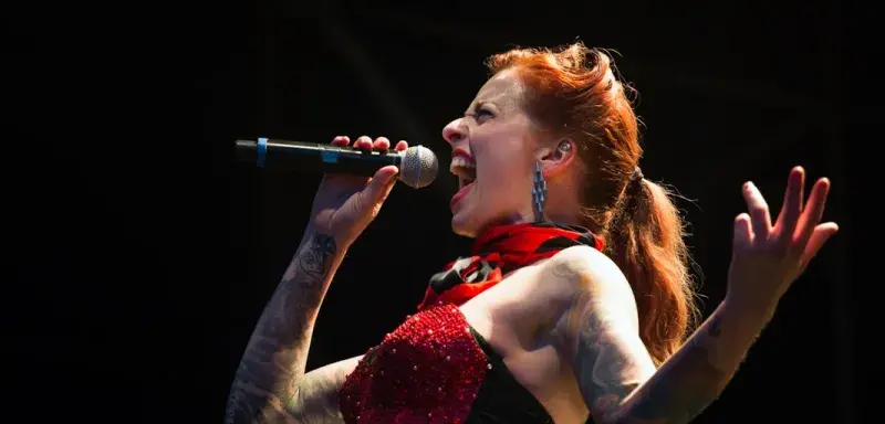 woman singing on wireless microphone