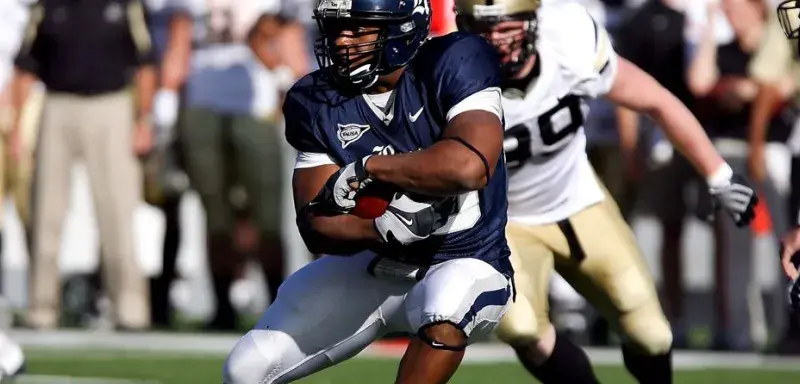 Intense moment captured during an American football game showcasing players in full action on the field.