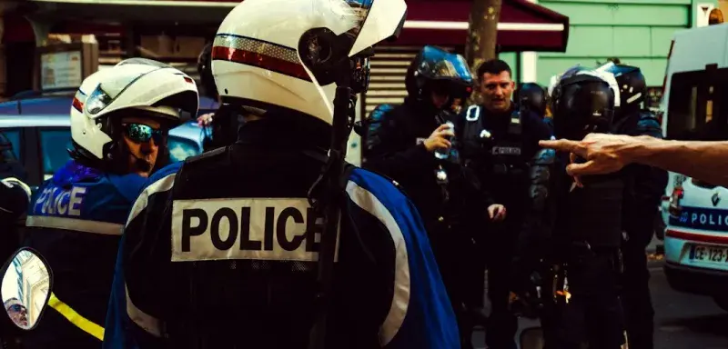 man in blue and white jacket wearing white helmet