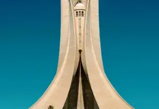 white concrete building under blue sky during daytime