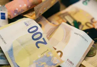 There is a pile of euro banknotes.