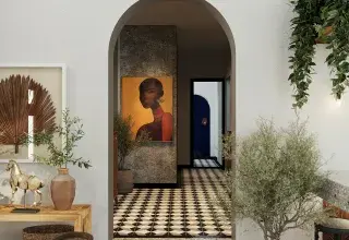 a hallway with a painting of a woman on the wall