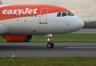 EasyJet airplane on the runway ready for departure at Bristol Airport. Side view close-up.