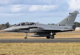 black jet plane on brown field under white clouds during daytime